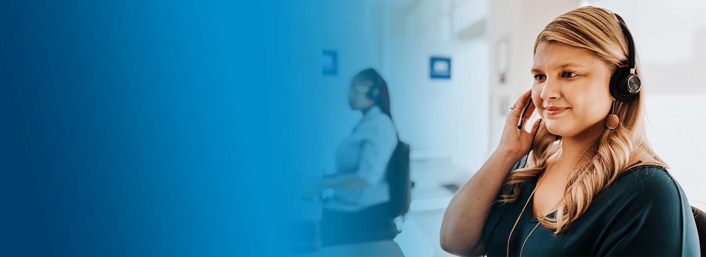 Woman on Member Care Team assisting customer over the phone