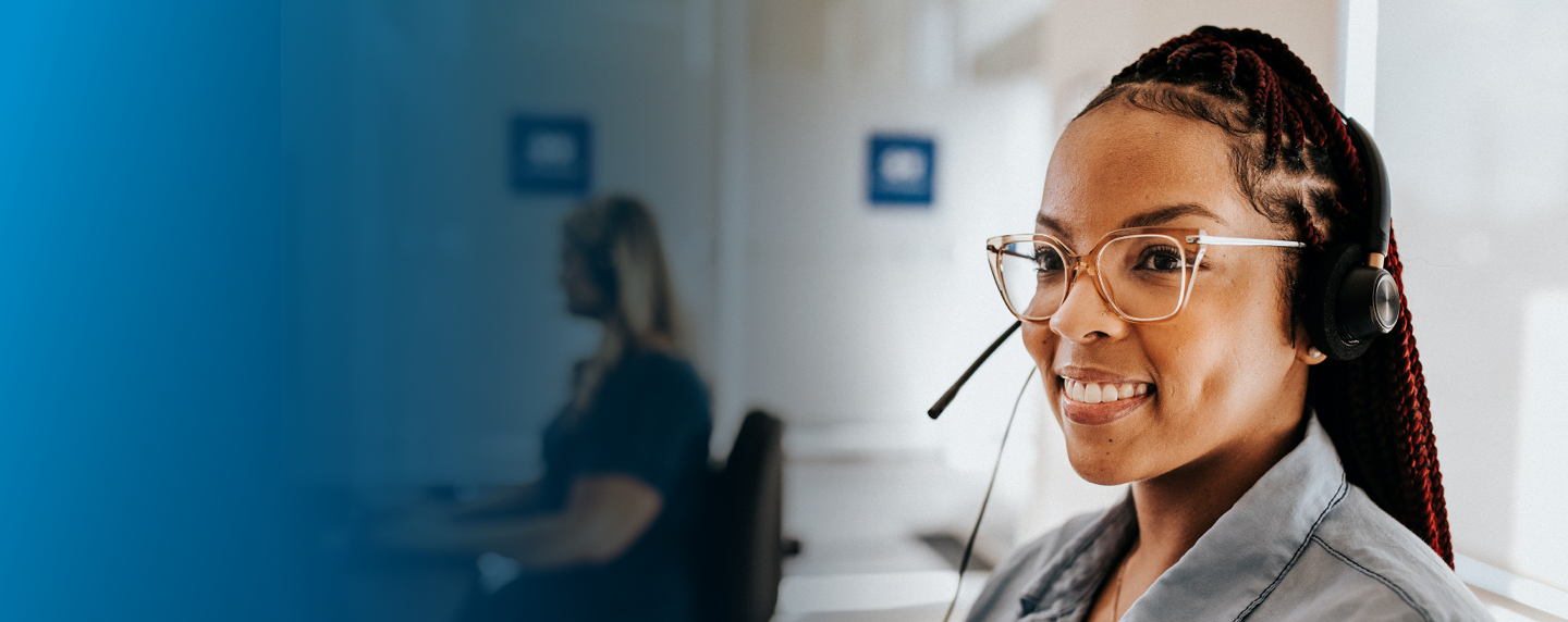 Woman on Member Care Team assisting customer over the phone